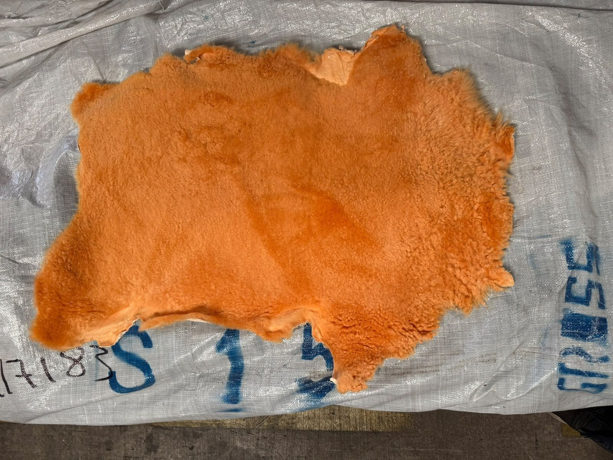 Chrome tanned sheepskin with 1 inch orange wool