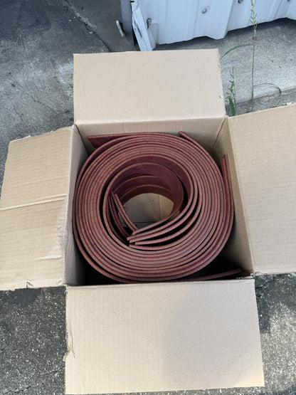 Box of burgundy latigo strips, rolled