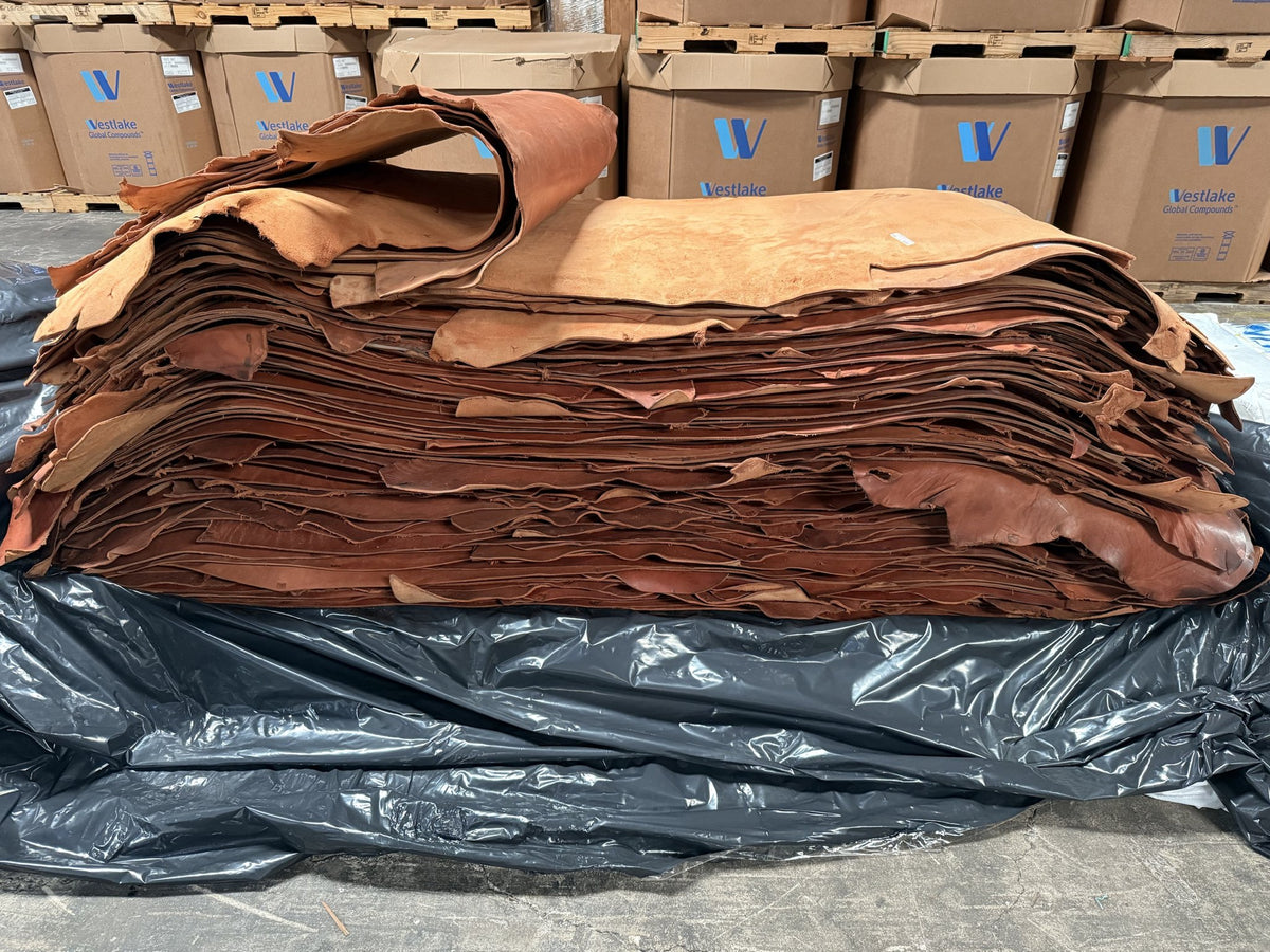 Stack of lightly oiled rose skirting bull sides
