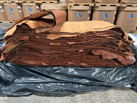 Stack of lightly oiled rose skirting bull sides